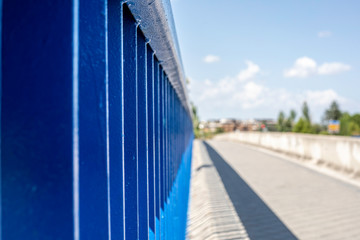 Bars of a bridge on the side of a road