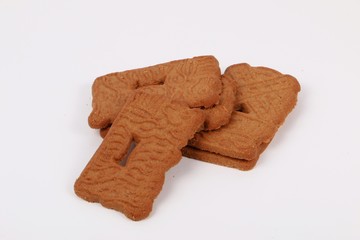 heap of delicious fresh christmas speculatius are lying in the white studio