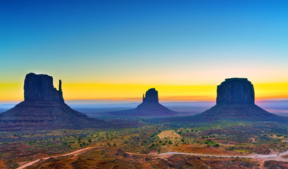 Fototapeta na wymiar View of Monument Valley at dawn near the border of Arizona and Utah in Navajo Nation Reservation in USA.