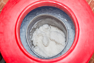 Fresh coconut milk ice cream in a bucket. bucket of coconut ice cream or ice cream coconut milk. bucket of ice cream in bike at Thai rural, delicious and inexpensive.