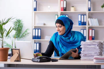 Female employee in hijab working in the office