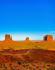 View of Monument Valley at sunset near the border of Arizona and Utah in Navajo Nation Reservation in USA.