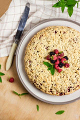 Berry shortcrust pie with crumble on plate