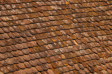 Old and ruined roofs. Texture of a roof with old roof tiles.