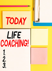 Conceptual hand writing showing Life Coaching. Concept meaning demonstrating employed to help showing attain their goals in career Empty papers with copy space on yellow background table