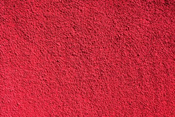 Bright pink - burgundy textured background in direct sun light.