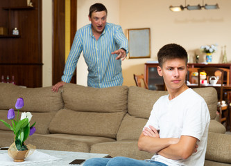 Dissatisfied father scolds young son