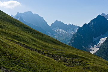 Obraz premium Mountain peak in black, covered with glaciers and snow. Dombay, Russia