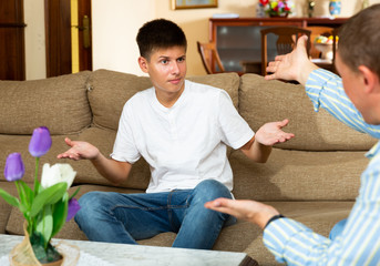 Angry father screaming at offender son