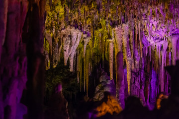 Formations of stalactites and stalagmites in a cave