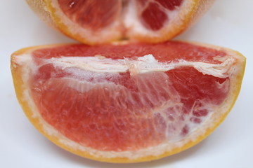 Sliced Inside of Grapefruit on a White Background