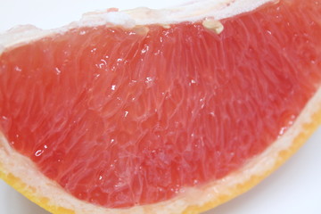 Sliced inside of Grapefruit on a white background