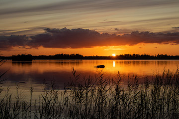 Fototapeta na wymiar Sunset by a lake in Sweden