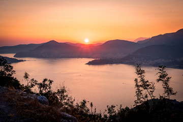 Sunset on the sea among the beautiful mountains, the Adriatic Sea. Montenegro.