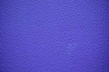 Fototapeta na wymiar Vibrant purple - blue textured surface.