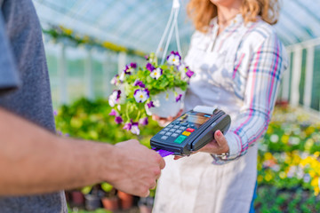 Credit card purchase in the flower nursery