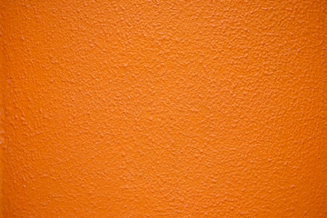 Saturated intensive orange textured surface.