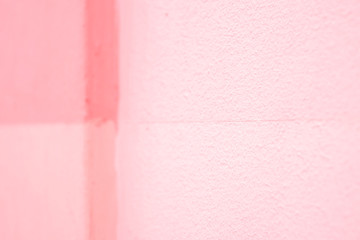 Four shades of pink, a graphic element, painted wall in selective focus perspective.