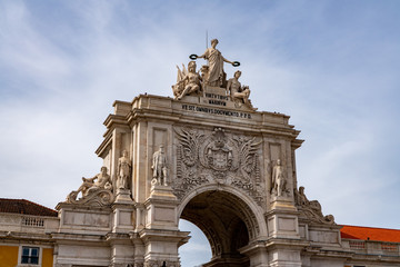 Fototapeta na wymiar Ornate palace entrance to the city in Praca do Comercio or Terreiro do Paco in downtown Lisbon
