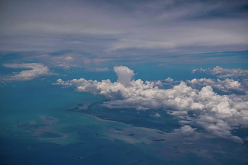 Fototapeta na wymiar Clouds over the florida coast from an aircraft headed south