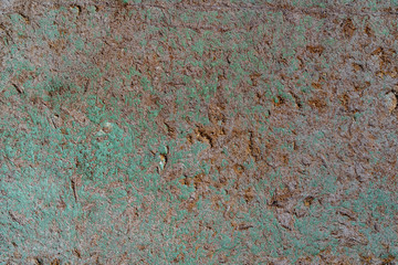 Old surface of pressed sawdust and the remains of faded green paint. Background for text or design