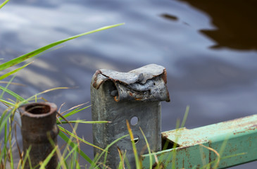 metal square pipe broken and bent by a hammer