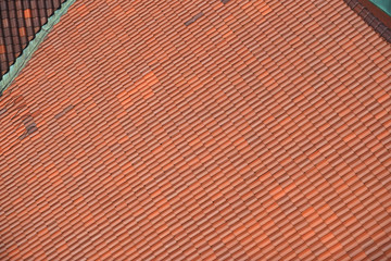 close up on red shingle on the roof