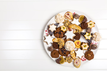 Assorted Christmas cookies on wooden table