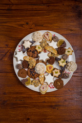 Assorted Christmas cookies on wooden table