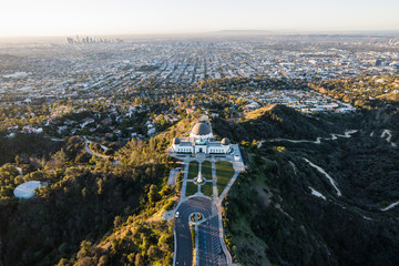 Early morning aerial above popular Griffith Park in Los Angeles, California. 