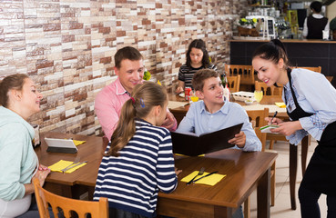 Waitress taking order from guests