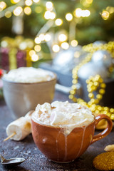 hot cocoa with marshmallows, cream and cookies on holiday christmas background