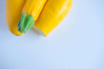 Background for a banner with yellow zucchini close-up. Organic products for vegetarians, raw foodists. Weight Loss and Nutrition Products