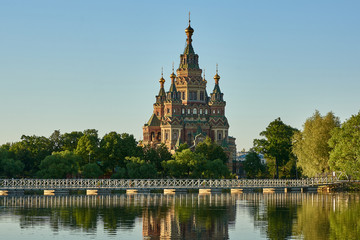 Russia. Peterhof. Holguin Pond. Cathedral of St. Peter and Paul behind the bridge