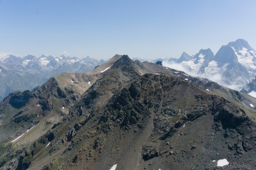 Mountain peak in black, covered with glaciers and snow. Dombay, Russia