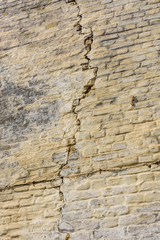 Old brick wall with big crack