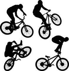 cyclist doing bike trick silhouettes