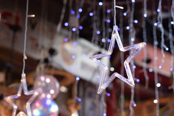 Led star shaped ornament close-up. Blurred background.