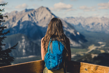 Woman at an overlook at the summit of Sulphur Mountain Trail, Banff National Park, Alberta, Canada