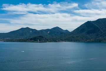 Lago maggiore ore lake maggiore beautiful panorama sunny day with blue sky and fluffy clouds