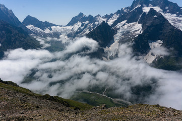 Mountain peak in black, covered with glaciers and snow. Dombay, Russia