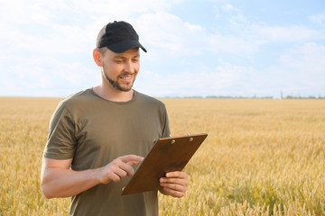 Farmer in field on sunny day