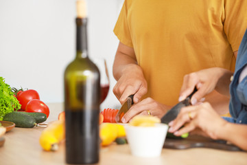 Young couple cooking together in kitchen
