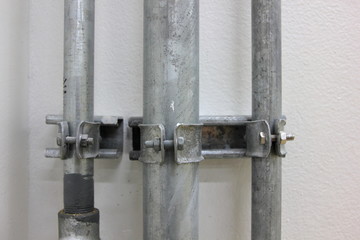 Conduit and clamp for cable electric ,Electrical Conduit with Clamp Installation on Roof ,Selective focus.