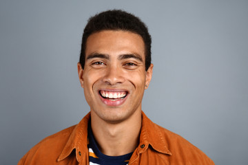 Handsome African-American man on grey background