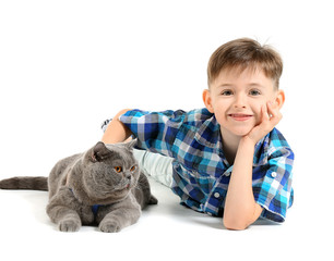Little boy with cute cat on white background