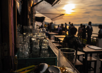 Empty glass At sunset, on the table with space for preparing for the party Along the Mekong River.soft focus.