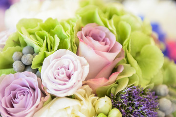 Three beautiful roses in different pink colors in a flower bouquet