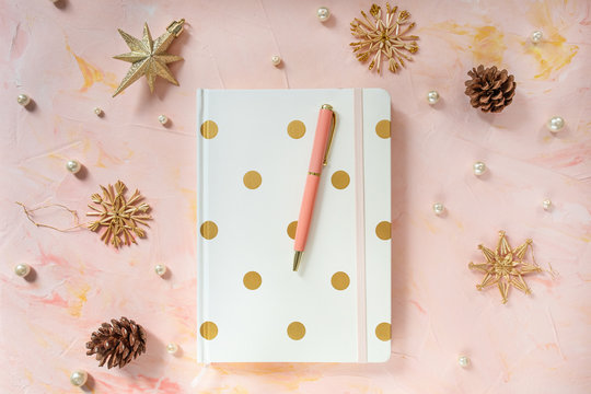 Notepad and pen on a desk workspace, winter template