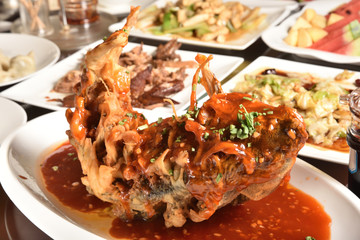 Deep fried fish topped with sweet and sour sauce.